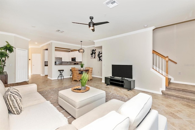 tiled living room featuring crown molding and ceiling fan