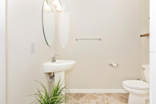 bathroom with tile patterned floors and toilet