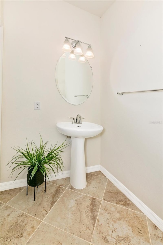 bathroom with sink and tile patterned floors