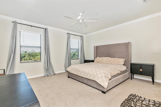 bedroom featuring crown molding, carpet, and ceiling fan