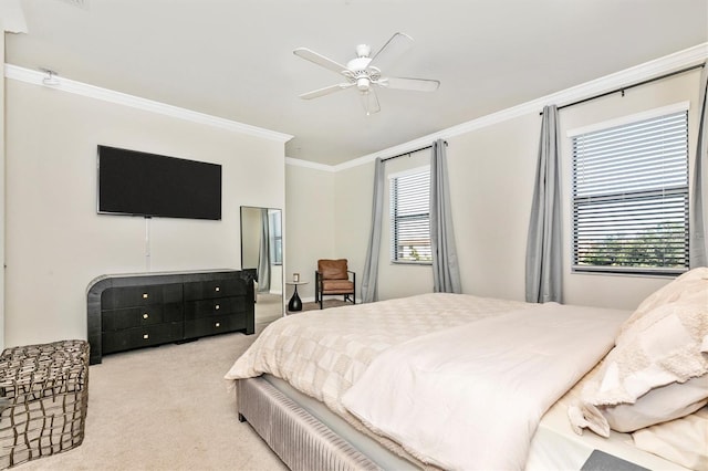 bedroom featuring ornamental molding, light carpet, and ceiling fan