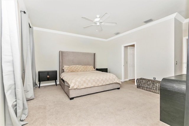 carpeted bedroom featuring ornamental molding and ceiling fan