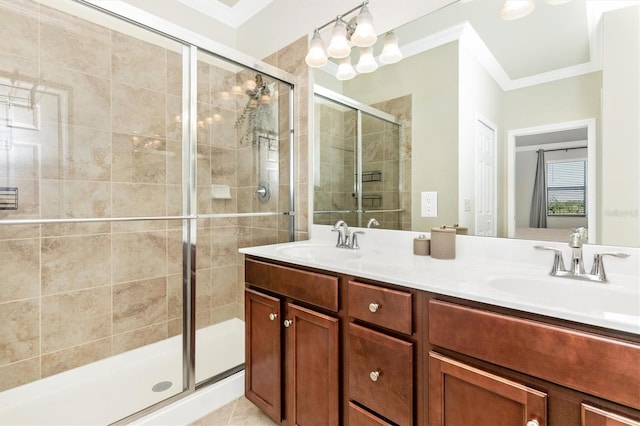 bathroom featuring vanity, tile patterned flooring, crown molding, and a shower with door