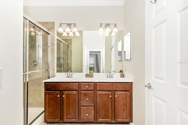 bathroom with ornamental molding, an enclosed shower, and vanity