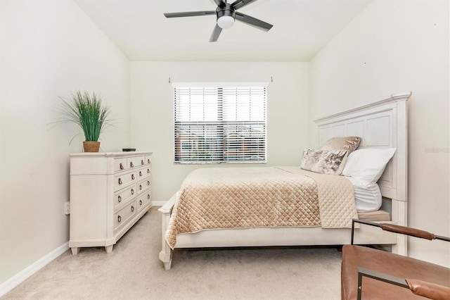 bedroom with ceiling fan and light carpet