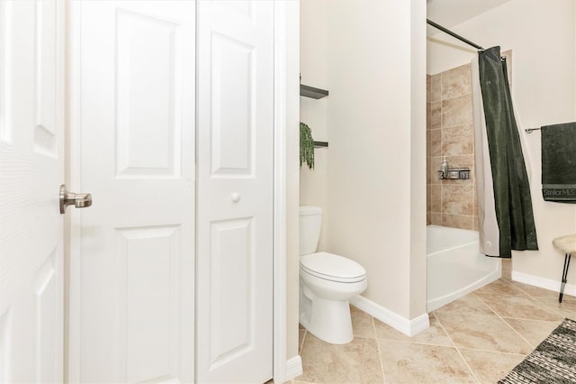 bathroom featuring shower / bathtub combination with curtain, tile patterned flooring, and toilet