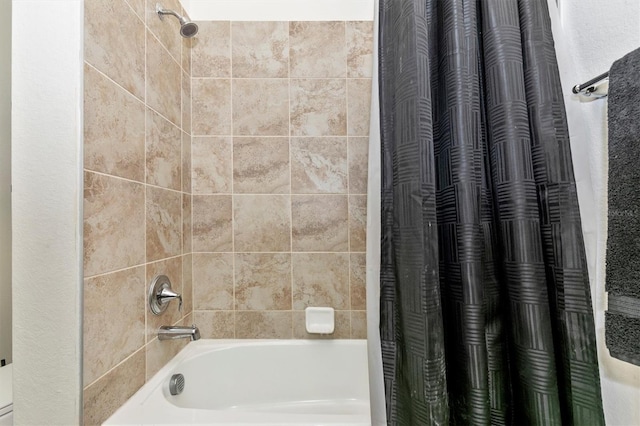 bathroom featuring shower / bath combo with shower curtain