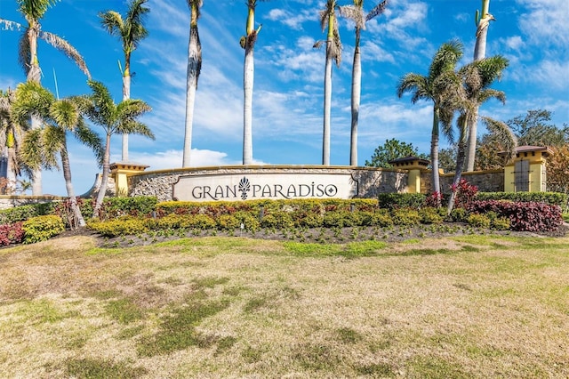 community / neighborhood sign with a lawn