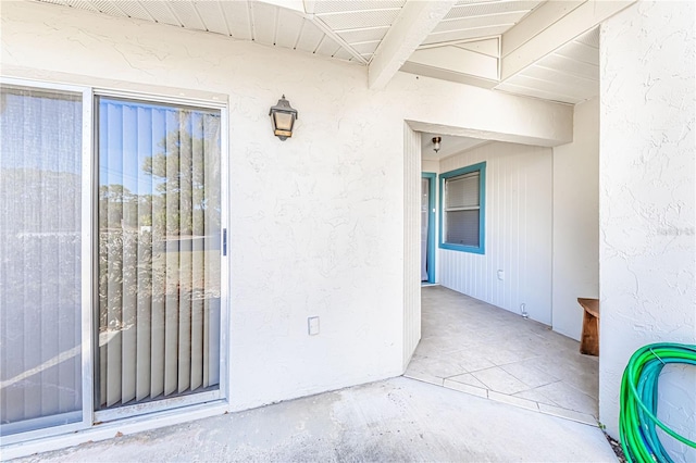 entrance to property with a patio area