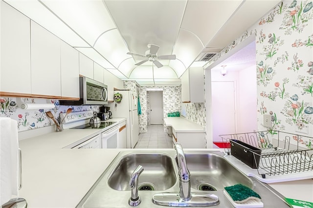 kitchen with white cabinetry, white appliances, ceiling fan, and sink