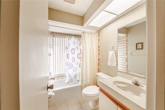 full bathroom with tile patterned flooring, vanity, shower / bath combination with curtain, a textured ceiling, and toilet