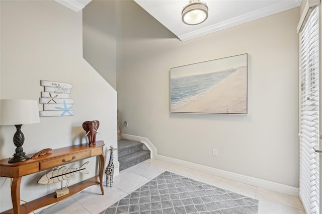 tiled entrance foyer with crown molding