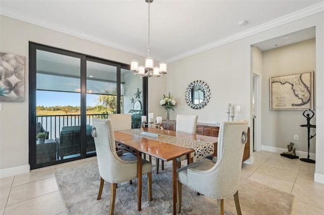 dining room with ornamental molding, a water view, light tile patterned floors, and a notable chandelier