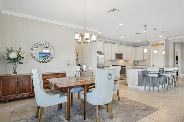 dining area with ornamental molding, sink, light tile patterned flooring, and a chandelier