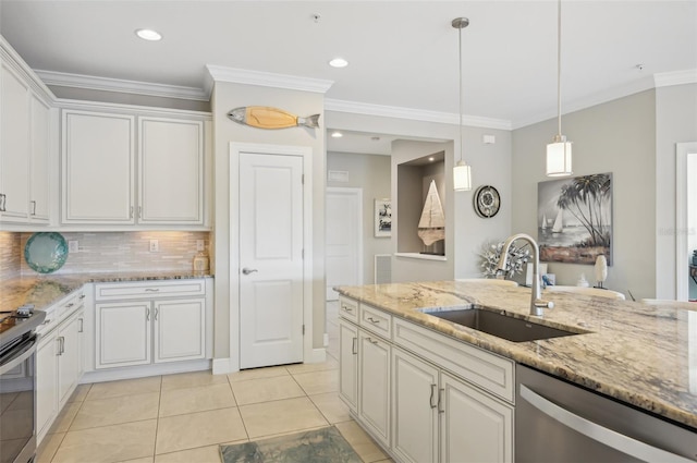 kitchen featuring light stone counters, stainless steel appliances, sink, and white cabinets