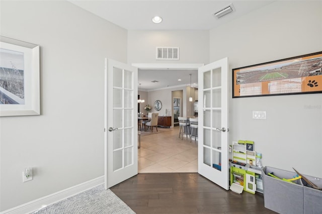 interior space featuring dark hardwood / wood-style floors and french doors