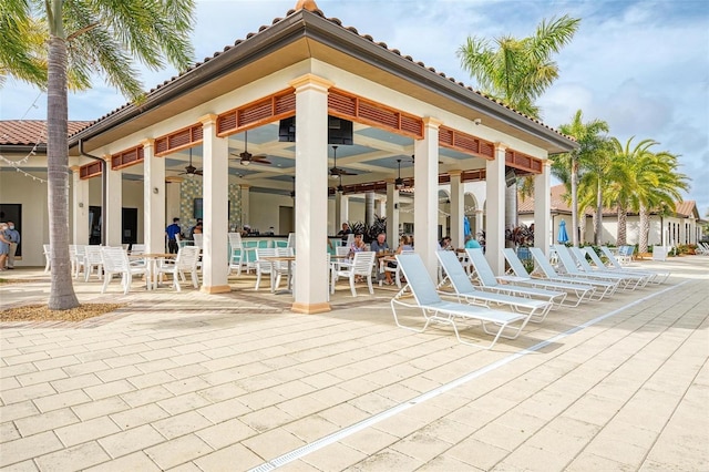 view of home's community with a patio area