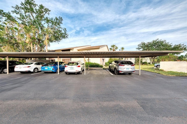 view of parking / parking lot featuring a carport