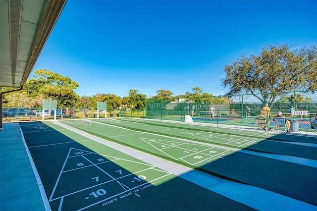 view of community with tennis court