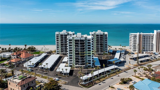 aerial view featuring a view of the beach and a water view