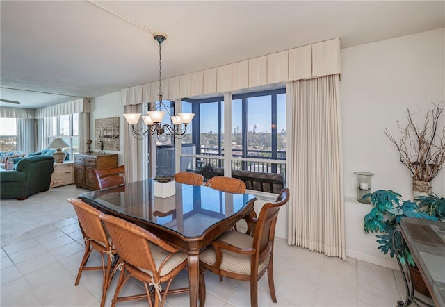 dining area featuring an inviting chandelier and light tile patterned floors