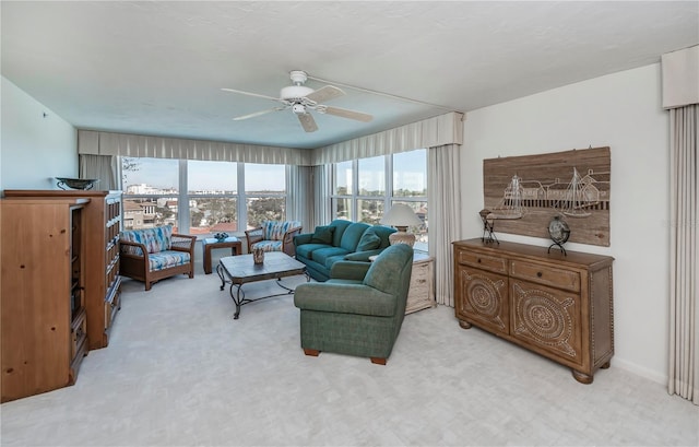 living room with ceiling fan and carpet floors