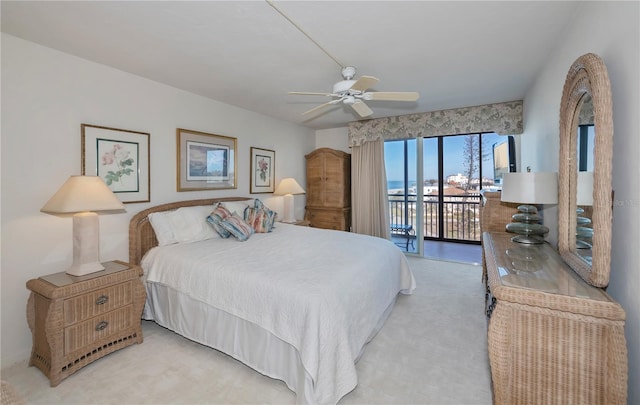 carpeted bedroom with access to exterior and ceiling fan