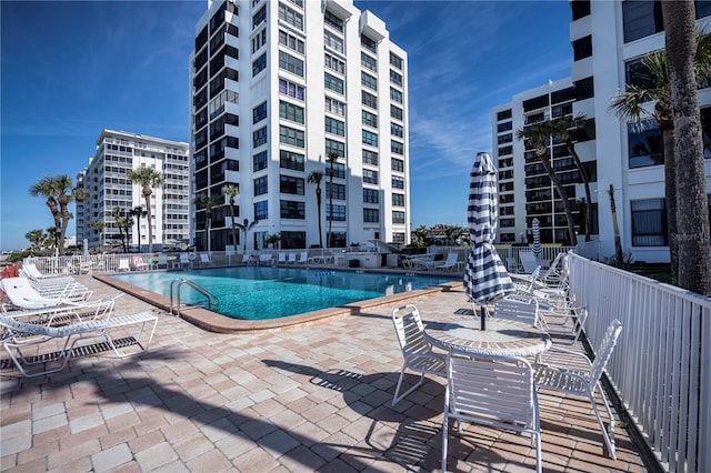 view of swimming pool with a patio area