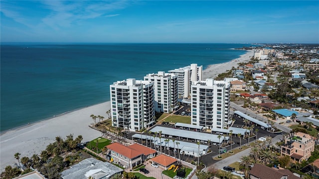 drone / aerial view featuring a water view and a view of the beach