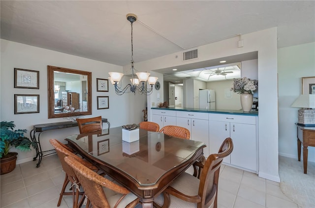 627 Alhambra Rd Unit 601, Venice, FL 34285 - dining space featuring light tile patterned floors, baseboards, a chandelier, and ceiling fan