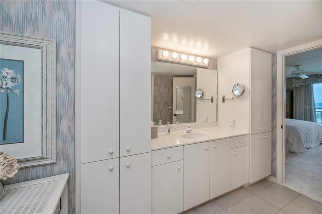 627 Alhambra Rd Unit 601, Venice, FL 34285 - bathroom featuring wallpapered walls, ensuite bath, vanity, and tile patterned floors