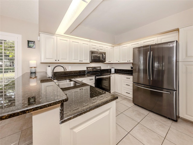 kitchen featuring sink, black appliances, kitchen peninsula, and white cabinets