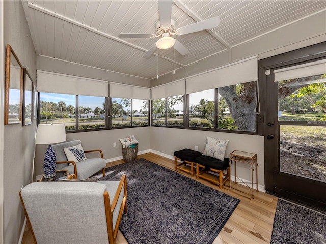 sunroom featuring wooden ceiling and ceiling fan