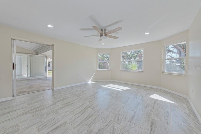 unfurnished room with ceiling fan