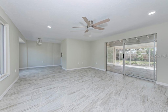 spare room featuring recessed lighting, marble finish floor, baseboards, and ceiling fan