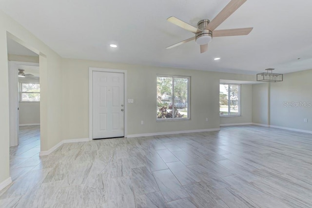 spare room featuring recessed lighting, baseboards, and ceiling fan