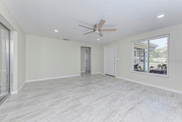 unfurnished room featuring a ceiling fan, visible vents, recessed lighting, and baseboards