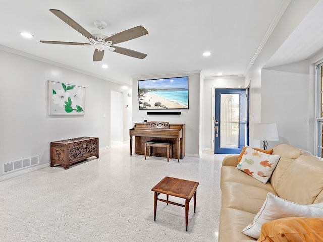 living room with crown molding and ceiling fan