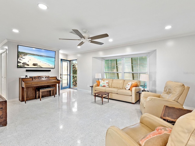 living room with crown molding and ceiling fan