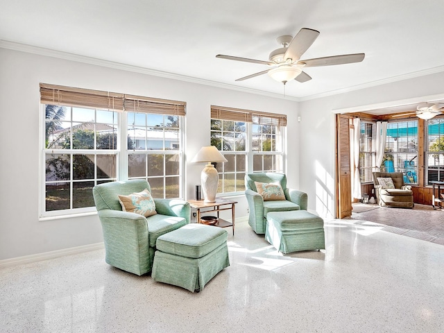 interior space with ceiling fan and ornamental molding