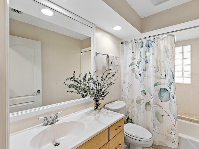 full bathroom with vanity, toilet, and shower / bath combo