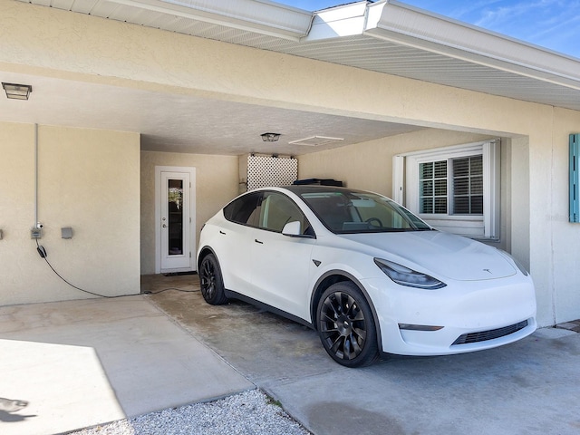 exterior space with a carport and electric panel