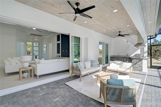 view of patio / terrace featuring outdoor lounge area, an outdoor kitchen, and ceiling fan