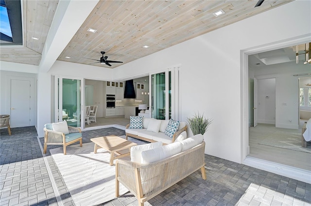 view of patio featuring ceiling fan and an outdoor living space