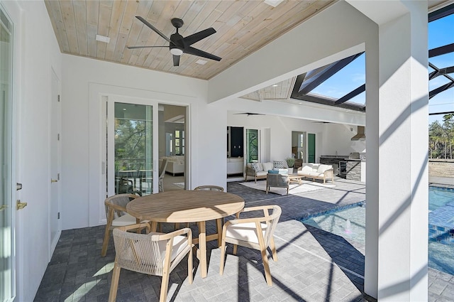 view of patio / terrace with an outdoor living space and ceiling fan