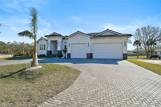 ranch-style house featuring a garage