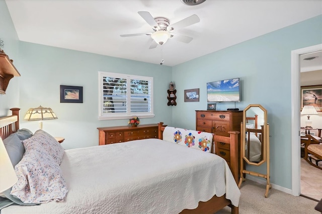 bedroom with light carpet and ceiling fan