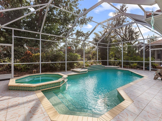 view of swimming pool with an in ground hot tub, glass enclosure, and a patio area