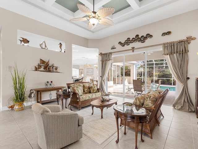 living room with light tile patterned floors, plenty of natural light, and ceiling fan