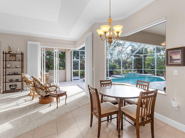 tiled dining area featuring a tray ceiling and ornamental molding